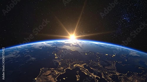 A bright sun rises over the dark curve of a glowing planet