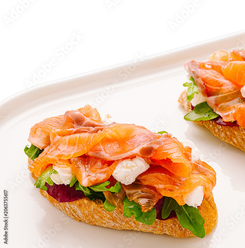 Cuadro en lienzo Smoked salmon bruschetta with arugula and cream cheese