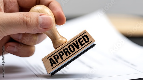 Approved rubber stamp, hand stamping document, official approval, business concept