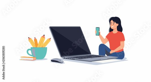 A woman sits cross-legged with a laptop, holding a phone