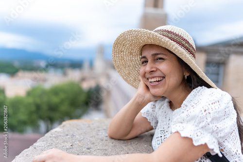 Quadro su tela Latin American woman enjoying her travel and exploring Girona city views in Spai