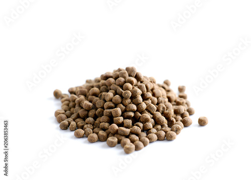 Pile of dry pet food on a white background.