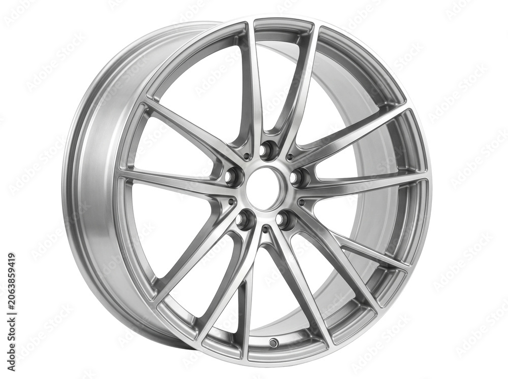 Obraz premium Shiny silver automotive alloy wheel with a complex multi spoke design featuring a polished metallic finish captured in a clean studio environment on a pure white background for high performance modern