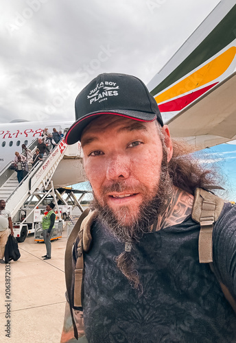 Traveler at Addis Ababa Airport preparing to board a plane for their journey