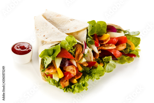 Kebab - grilled meat and vegetables on white background
