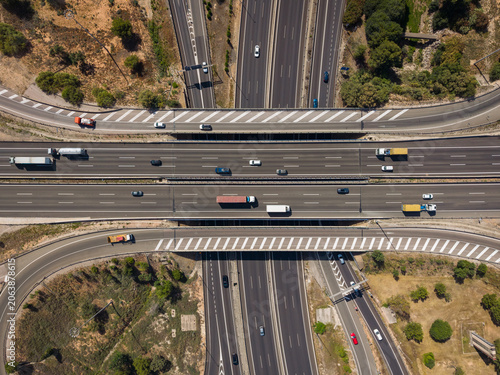 Obraz na plátně Top-down aerial view of a multilane motorway interchange overpass in Spain with