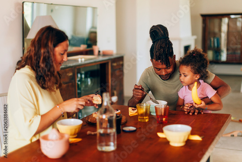 Family enjoying happy breakfast together at home