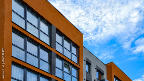 Schilderij op canvas Modern residential building facade against blue sky
