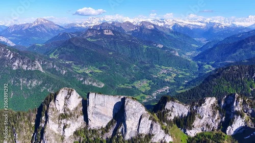 4K Drone Side Slide Along Alpine Cliffs With Mountain Panorama