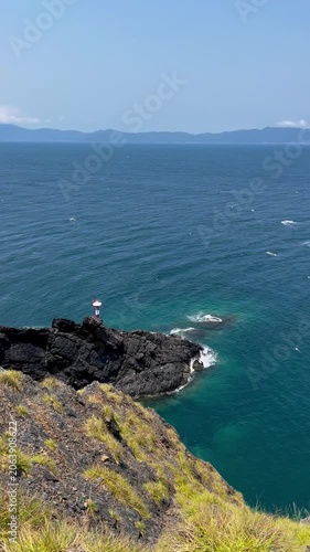 Lonely Lighthouse on Cliff in Vietnam - Solitary Coastal Lighthouse Overlooking Ocean Sea - Dramatic Seascape with Lighthouse on Rocky Cliff