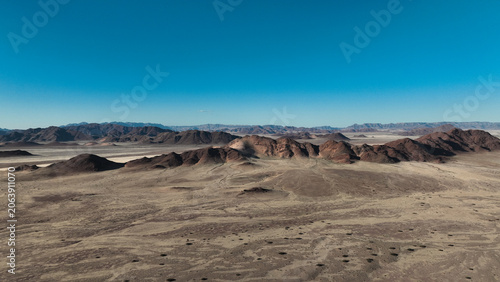 Views of Sossusvlei desert landscape under clear blue sky in Namibia