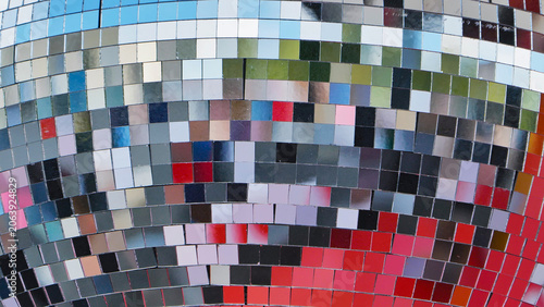 Colorful disco ball reflecting light during a sports day celebration