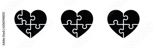 Fotografía Three black puzzle heart icons representing connection and unity on white backgr