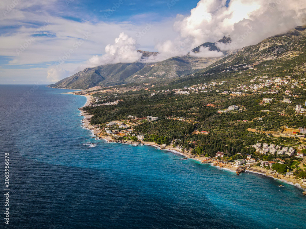 Obraz premium 23 November 2021 Editorial: Aerial view of coastal landscape, turquoise sea, mountains, and residential buildings.