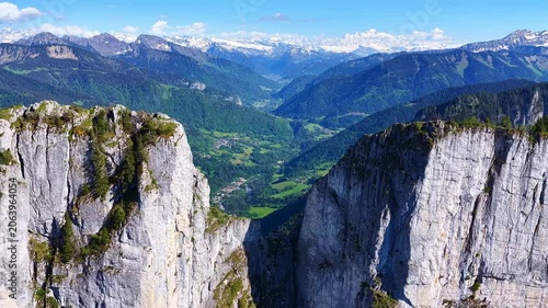 4K Drone Pullback Revealing Massive Alpine Cliffs and Valley