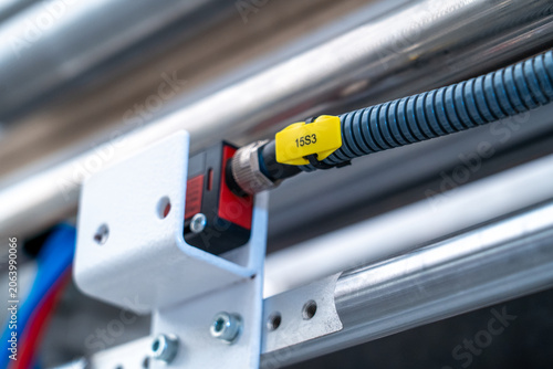 Bild auf Leinwand Industrial photoelectric sensor transmitting signals for factory automation syst