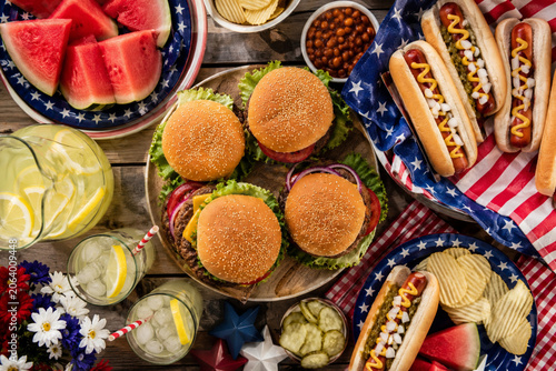Delicious American 4th of July barbecue picnic feast on a rustic wooden table