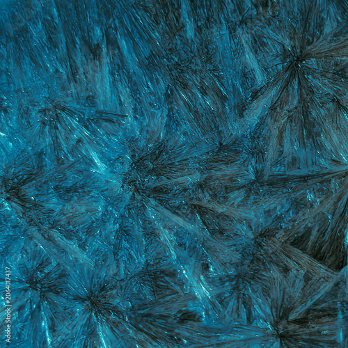 Macro photography of natural labradorite mineral with iridescent shimmer and unique crystalline texture, square crop