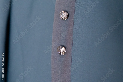 Blue fabric with crystal buttons close-up detail
