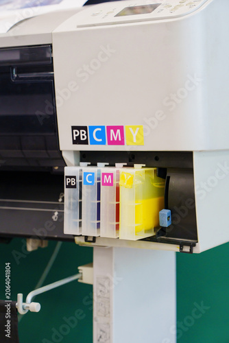 CMYK Ink Tank Cartridges Installed in Large Format Plotter Printer