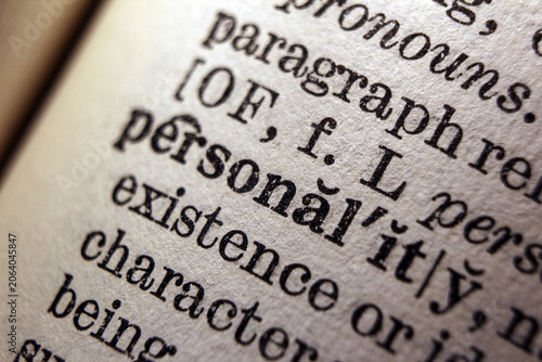 Word personality on dictionary page, macro close up
