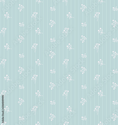 Seamless vintage floral pattern with delicate white sprays on soft pastel blue vertical stripes. Romantic folk art design for textile, fabric, wallpaper, wrapping paper  spring decor