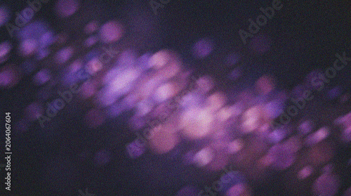 Foto Purple Bokeh Light Background with Soft Glowing Particles