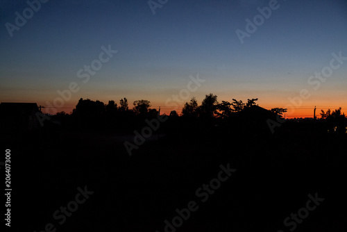 beautiful sunset outside the city in summer