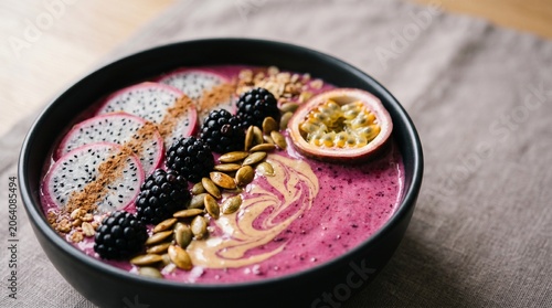 Quadro su tela Healthy smoothie bowl with dragon fruit blackberry and passion fruit toppings in