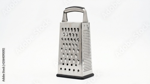 kitchen utensil, this multi-sided metal box grater is ready for food preparation tasks such as shredding cheese or grating vegetables.