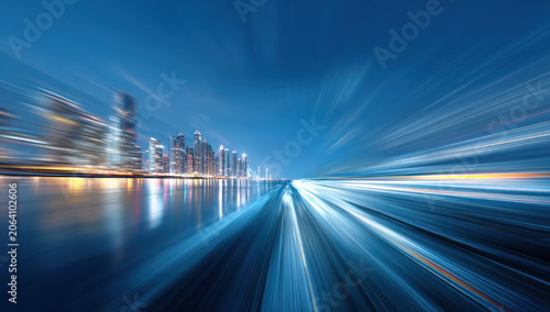 Night urban scene with motion blur effect, showing city skyline by calm water and light streaks implying high speed.