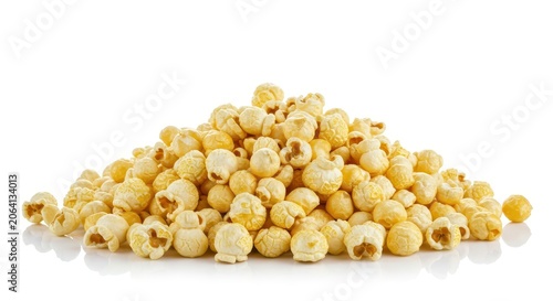 A large pile of fluffy, freshly popped popcorn kernels, ready for snacking, scattered and isolated against a clean, brilliant white background, plain background, studio shot, movie