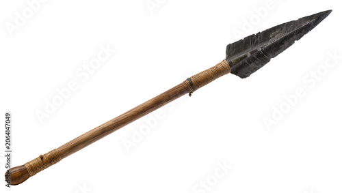 Foto Ancient spear with stone arrowhead and wooden shaft
