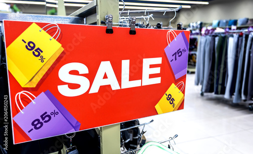 Sale banner stand at the clothing boutique with sale information. Promotion, advertising, shopping and black friday