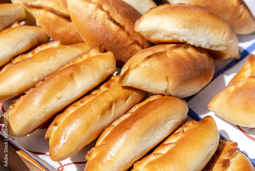 Fresh appetizing pies with various fillings