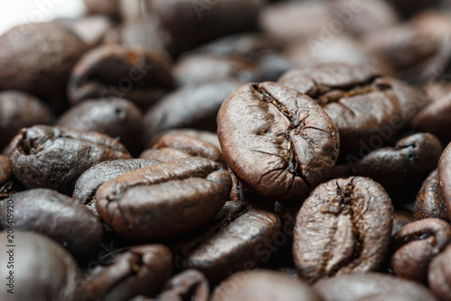 Dark roasted coffee beans  ,close up used  background