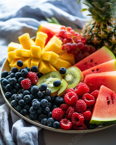 Fresh fruit platter with watermelon, berries, mango and pineapple