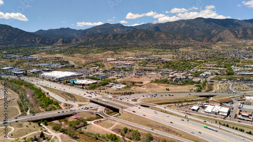 Tableau sur toile Aerial drone shot of Colorado Springs highway bridge and commercial district wit