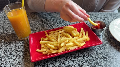 French fries with orange juice and ketchup