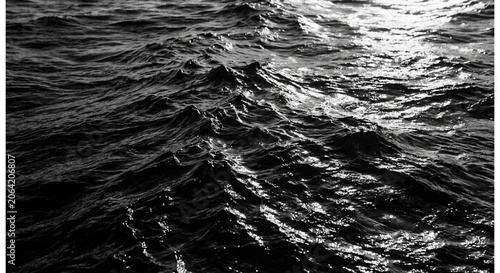 Moody and Intense Close-up View of Raging Dark Ocean Waves at Night, Capturing the Power and Raw Energy of the Sea with Deep Reflections and Rhythmic Motion in Black and White