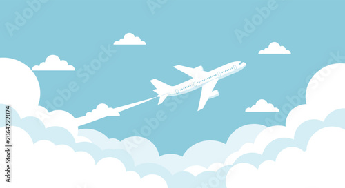 Commercial airplane flies majestically through a blue sky filled with soft white clouds leaving a long vapor trail during its journey.