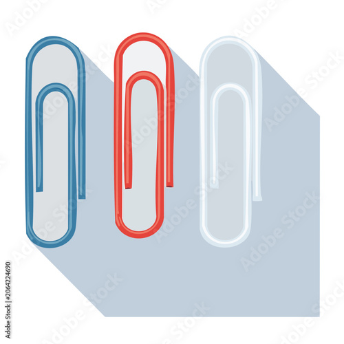 Three colored paper clips on gray background