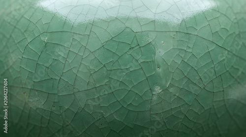 Macro close-up of crackled celadon glaze surface on traditional Chinese porcelain, historic ceramic craft texture