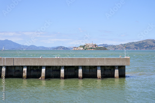 Canvastavla Pier extending into San Francisco Bay with Alcatraz Island in the distance