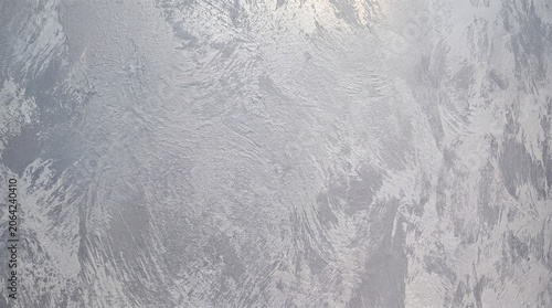Silver silk Venetian plaster with a matte texture for the walls.