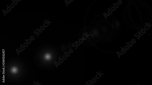Abstract lens flare overlay with glowing light orbs on black background
