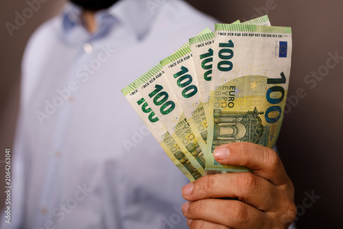 Man displaying multiple one...