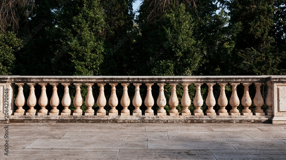 Naklejka premium Elegant stone balustrade defining a formal garden terrace, overlooking dense green trees under warm, natural daylight