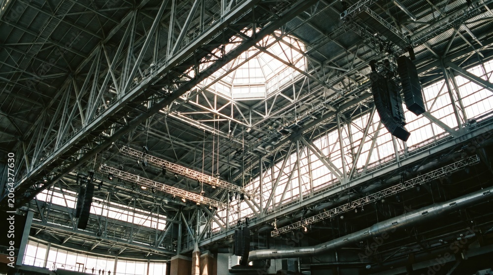 Fototapeta premium Industrial building interior with metal beams.