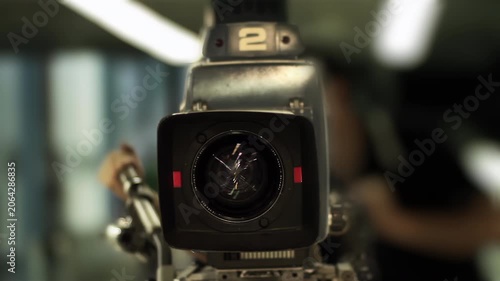 Retro TV Studio Equipment Lens Detail with Blurred Operator - 4K